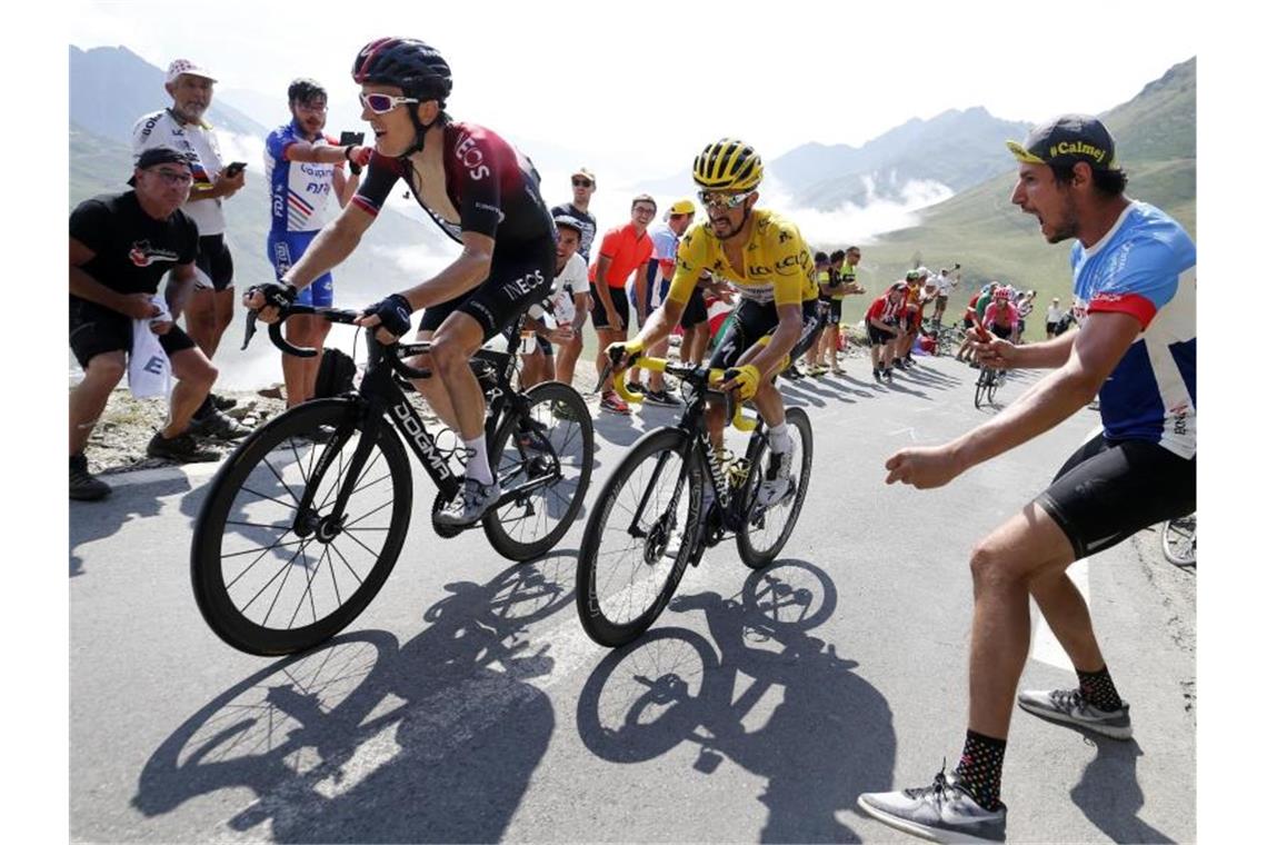 Kann sich eine Tour ohne Zuschauer nicht vorstellen: Ex-Sieger Geraint Thomas (l). Foto: Yuzuru Sunada/BELGA/dpa