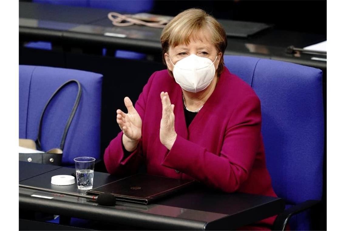 Kanzlerin Angela Merkel möchte im Bundestag die Corona-Notbremse beschließen. Foto: Kay Nietfeld/dpa