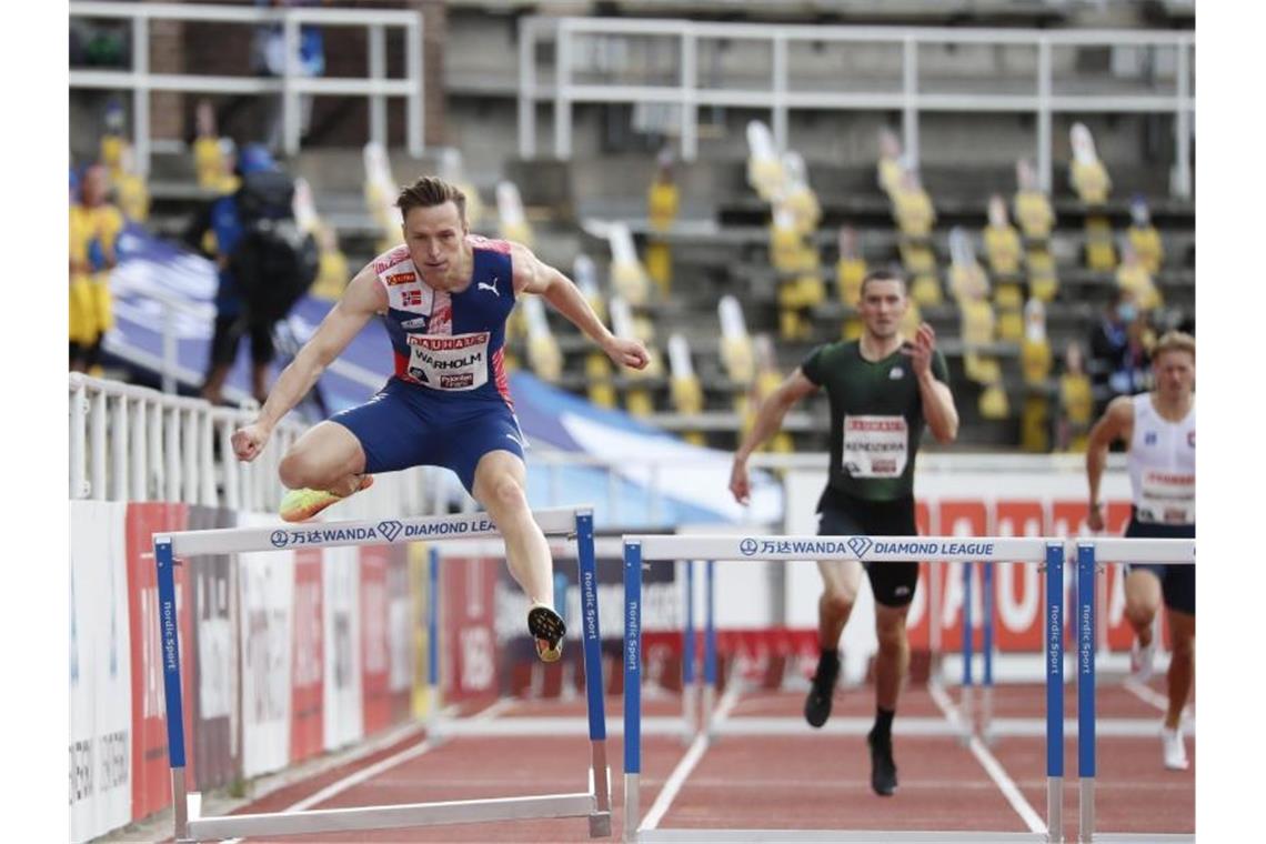 Karsten Warholm (l) hat seinen Europarekord über 400 Meter Hürden verbessert. Foto: Christine Olsson/TT NEWS AGENCY/dpa