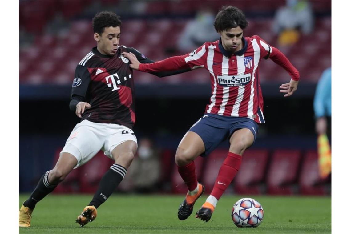 Keine Angst vor den Atlético-Stars: Bayerns Jamal Musiala (l) und Madrids Joao Felix. Foto: Bernat Armangue/AP/dpa