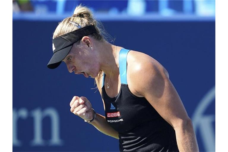 Kerber ballt die Faust und jubelt - gegen Jelena Ostapenko setzt sie sich 4:6, 6:2, 7:5 durch. Foto: Kareem Elgazzar/The Cincinnati Enquirer/AP/dpa