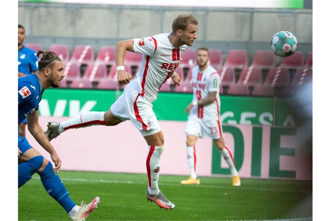 Kölns Sebastian Andersson (M) erzielt das 1:1 gegen Hoffenheim. Foto: Federico Gambarini/dpa