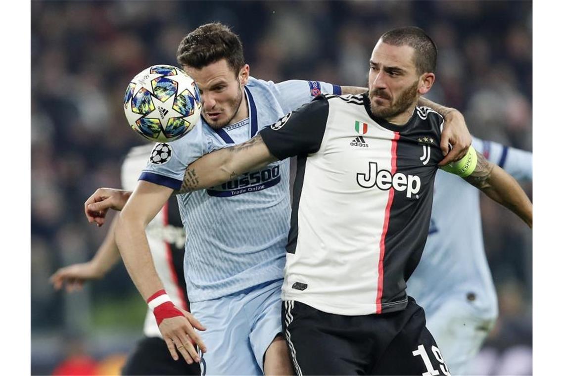 Leonardo Bonucci (r) setzte sich mit Juventus gegen Atlético Madrid durch. Foto: Antonio Calanni/AP/dpa