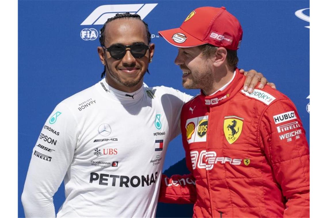 Vettel am „Scheideweg“ seiner Formel-1-Karriere Lewis Hamilton (l) will Sebastian Vettel trotz seines großen Vorsprungs nicht abschreiben. Foto: Paul Chiasson/The Canadian Press/AP