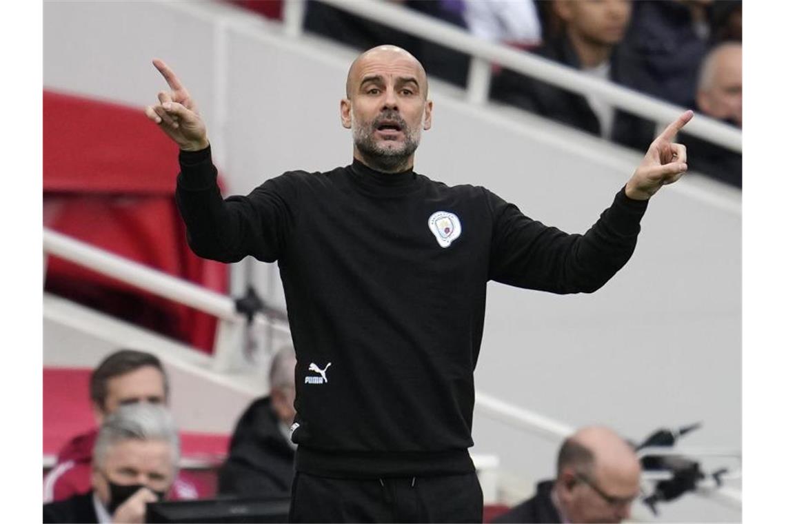 21 Corona-Verdachtsfälle bei Man City - Guardiola infiziert Manchester Citys Coach Pep Guardiola hat sich mit dem Coronavirus infiziert. Foto: Matt Dunham/AP/dpa