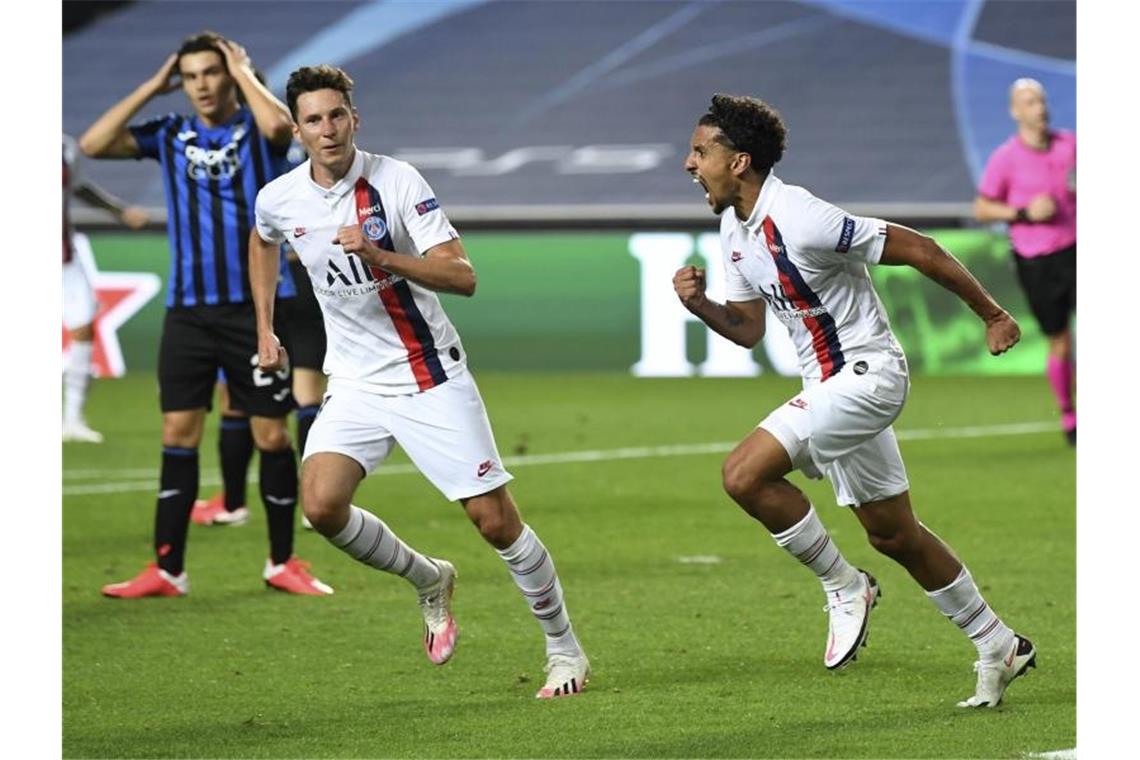 Marquinhos (r) drehte mit seinem Ausgleichstreffer das Spiel zu Gunsten von PSG. Foto: David Ramos/Pool Getty/AP/dpa