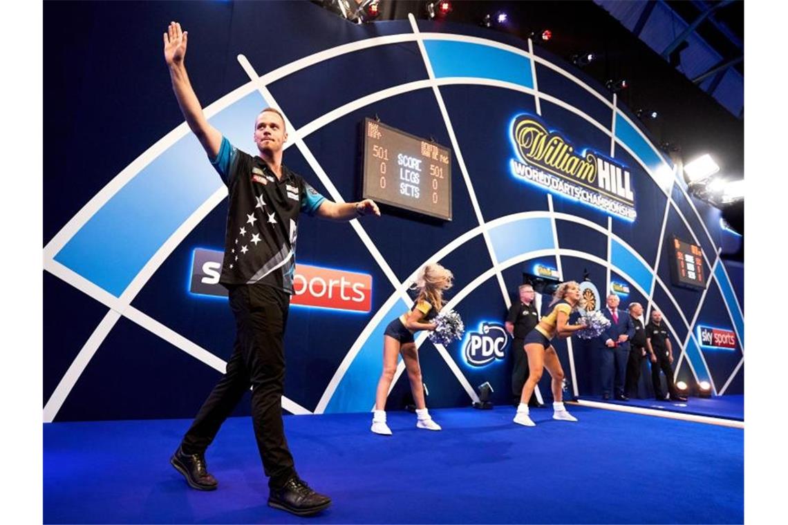 Warum Darts und Olympia schwer zueinanderfinden Max Hopp würde Darts gerne im Programm der Olympischen Spiele sehen. Foto: John Walton/PA Wire/dpa