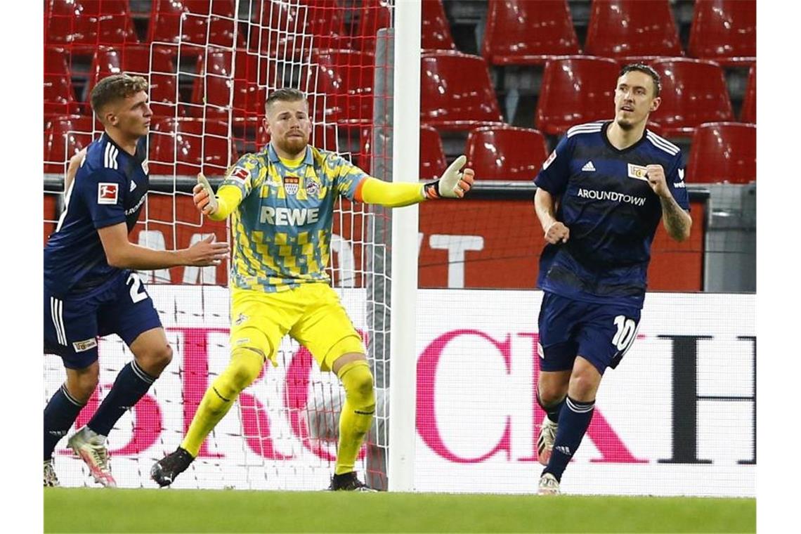 Max Kruse (r) machte den Union-Sieg in Köln perfekt. Foto: Thilo Schmuelgen/Reuters Images Europe/Pool/dpa