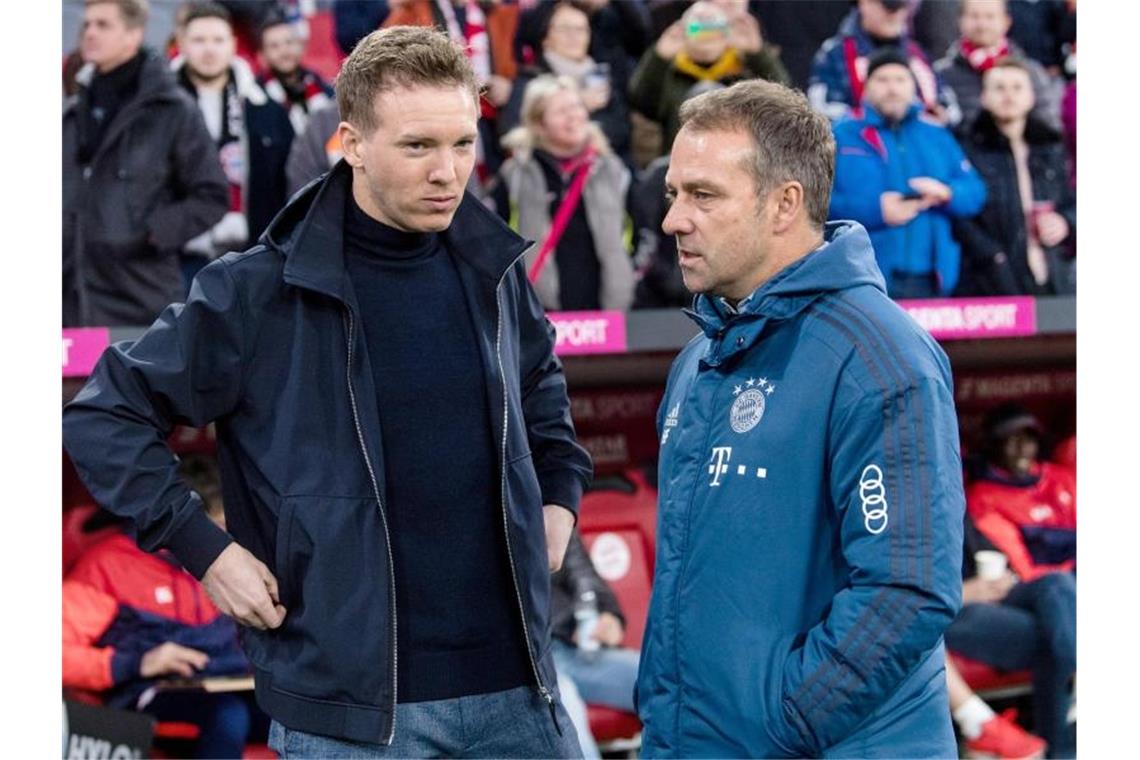 Mit der Verpflichtung von Trainer Julian Nagelsmann (l) macht Bayern München für Hansi Flick den Weg ins Amt des Bundestrainers frei. Foto: Matthias Balk/dpa