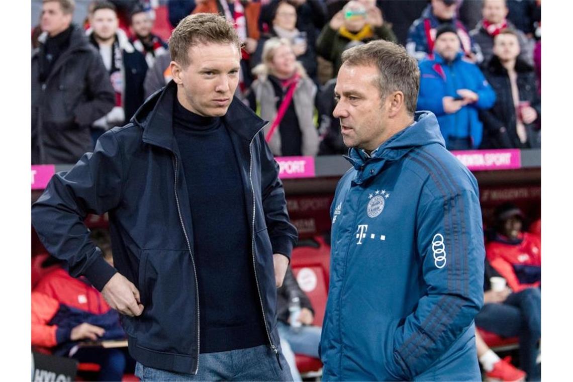 Nagelsmann zum „Lebenstraum“ Bayern - Flick bald zum DFB? Mit der Verpflichtung von Trainer Julian Nagelsmann (l) macht Bayern München für Hansi Flick den Weg ins Amt des Bundestrainers frei. Foto: Matthias Balk/dpa