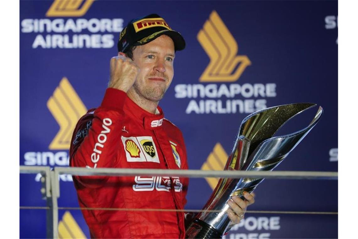 Nach 392 Tagen konnte Sebastian Vettel mal wieder ein Formel-1-Rennen für sich entscheiden. Foto: Vincent Thian/AP