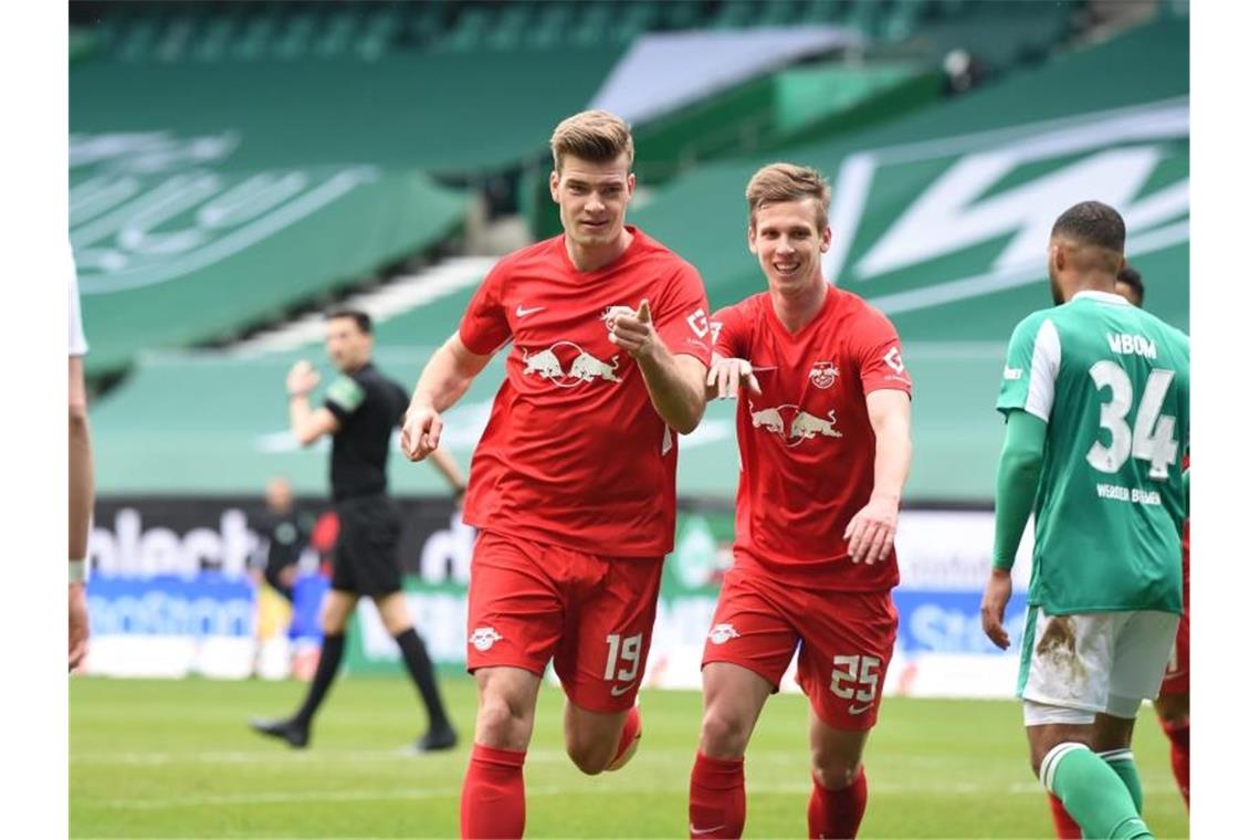 Zurück im Titelrennen? Leipzig schaut gespannt nach München Nach Leipzigs Sieg in Bremen und Bayerns Patzer gegen Union keimen nochmal Titelhoffnungen bei RB. Foto: Carmen Jaspersen/dpa