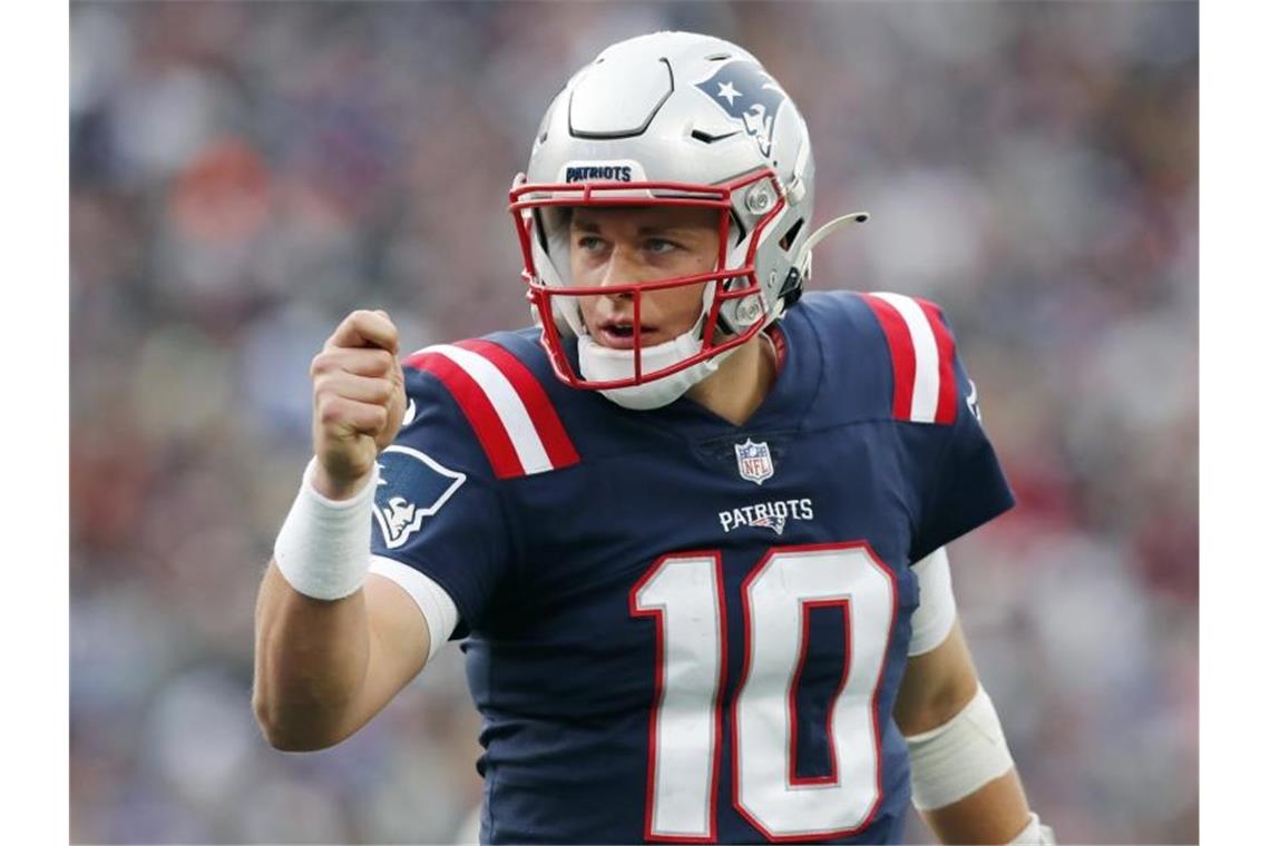 Patriots holen vierten Sieg in Serie - Lions unentschieden New England Patriots-Quarterback Mac Jones jubelt nach einem Touchdown von Rhamondre Stevenson. Foto: Michael Dwyer/AP/dpa