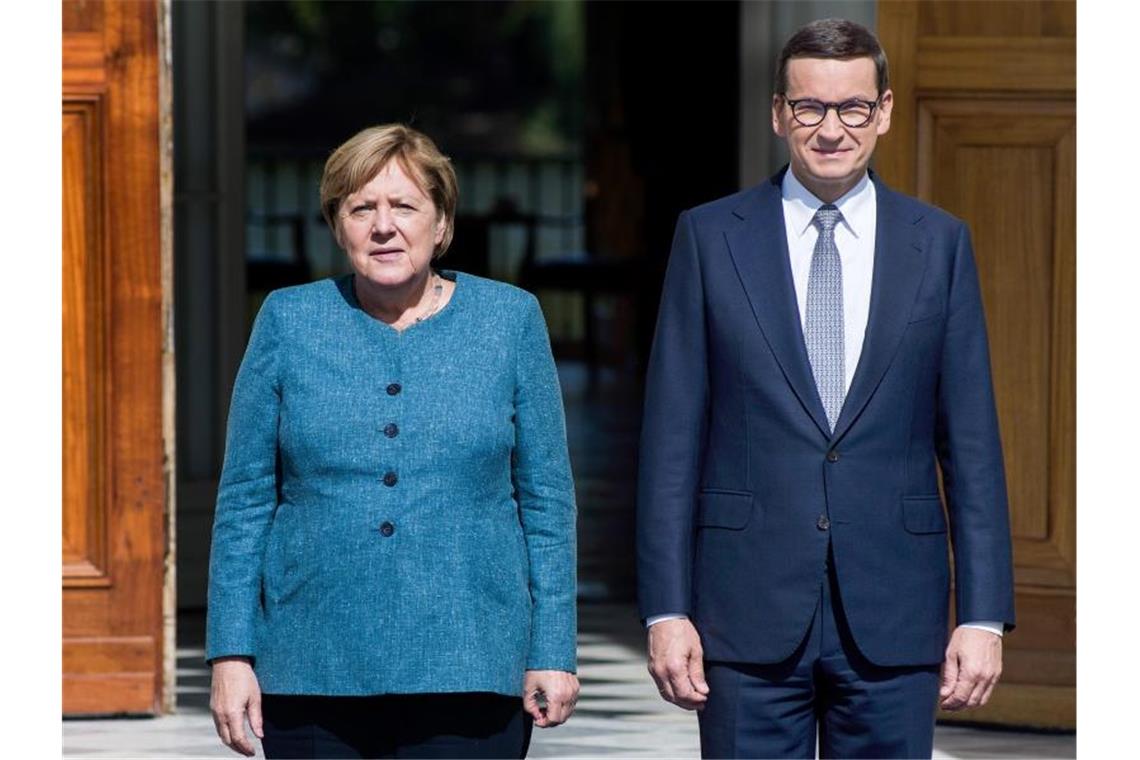 Noch-Bundeskanzlerin Angela Merkel und der polnische Ministerpräsidenten Mateusz Morawiecki. Foto: Attila Husejnow/SOPA Images via ZUMA Press Wire/dpa