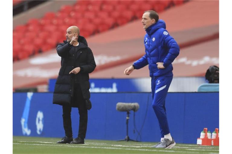 Pep Guardiola (l) verlor das Trainerduell mit Thomas Tuchel. Foto: Adam Davy/Pool PA/AP/dpa