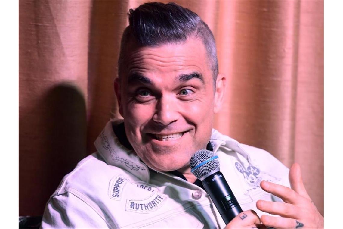Robbie Williams kämpft mit Humor gegen Krisen Popstar Robbie Williams. Foto: Ian West/PA Wire/dpa/Archivbild