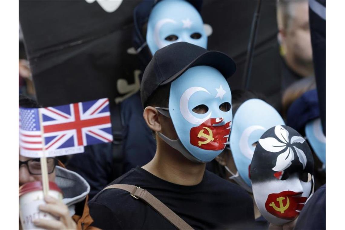Pro-demokratische Demonstranten während eines Protestmarsches in Hongkong. Foto: Kiichiro Sato/AP/dpa