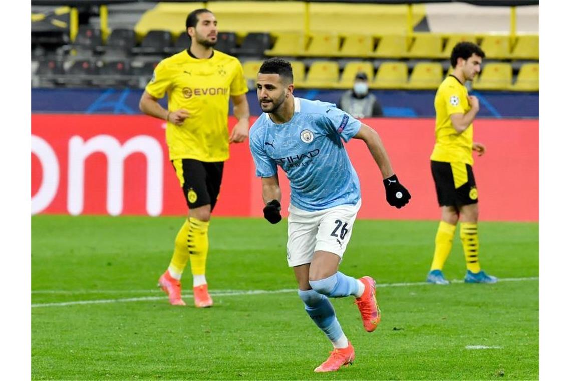Trotz großem Kampf gegen Man City: Aus für den BVB Riyad Mahrez (M) von Manchester jubelt nach seinem Treffer zum 1:1 per Elfmeter. Foto: Martin Meissner/AP-Pool/dpa