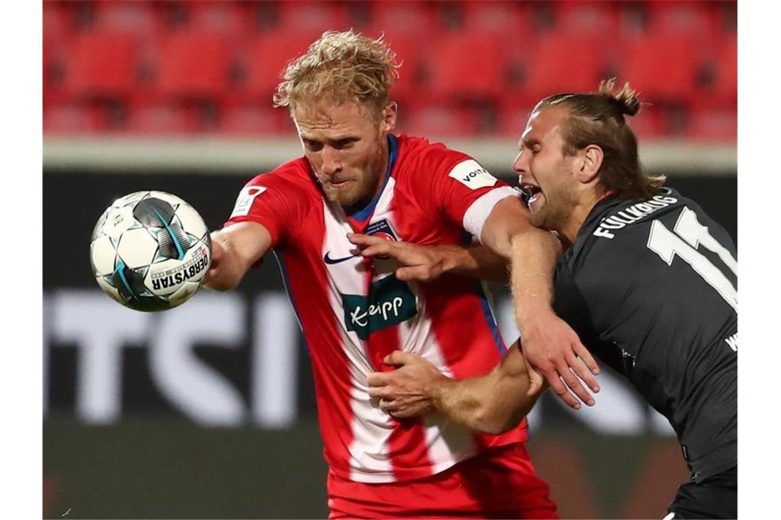Nach verpasstem Aufstieg: In Heidenheim beginnt Ausverkauf Routinier Sebastian Griesbeck (l) wechselt laut „Bild“ zu Bundesligist 1. FC Union Berlin. Foto: Tom Weller/dpa/Archivbild