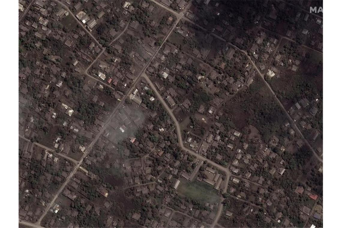 Satellitenbild von aschebedeckten Häusern auf Tonga. Foto: Uncredited/Satellite image ©2022 Maxar Technologies/dpa