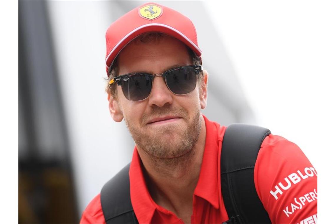 Vettel im Hockenheim-Abschlusstraining Dritter Sebastian Vettel aus Deutschland vom Team Scuderia Ferrari kommt ins Fahrerlager. Foto: Sebastian Gollnow