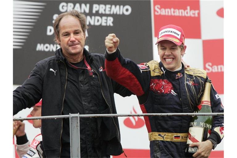 Sebastian Vettel (r) freut sich 2008 mit dem damaligen Torro Rosso-Mitbesitzer Gerhard Berger über seinen ersten F1-Sieg in Monza. Foto: Felix Heyder/dpa