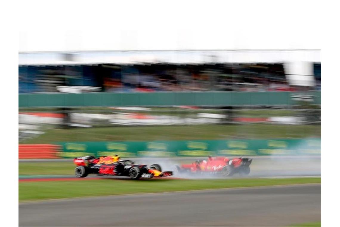 Sebastian Vettel (r) und Max Verstappen kollidierten in der 38. Runde. Foto: David Davies/PA Wire
