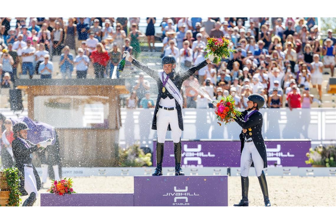 Werth scheitert bei Dressur-EM erneut am 10. Einzel-Gold Sektdusche für den Sieger: Isabell Werth (r) feiert mit Europameister Justin Verboomen (M).