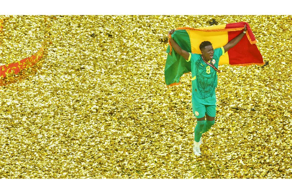 Senegals Lamine Camara jubelt nach dem Sieg gegen Marokko im Afrika Cup.