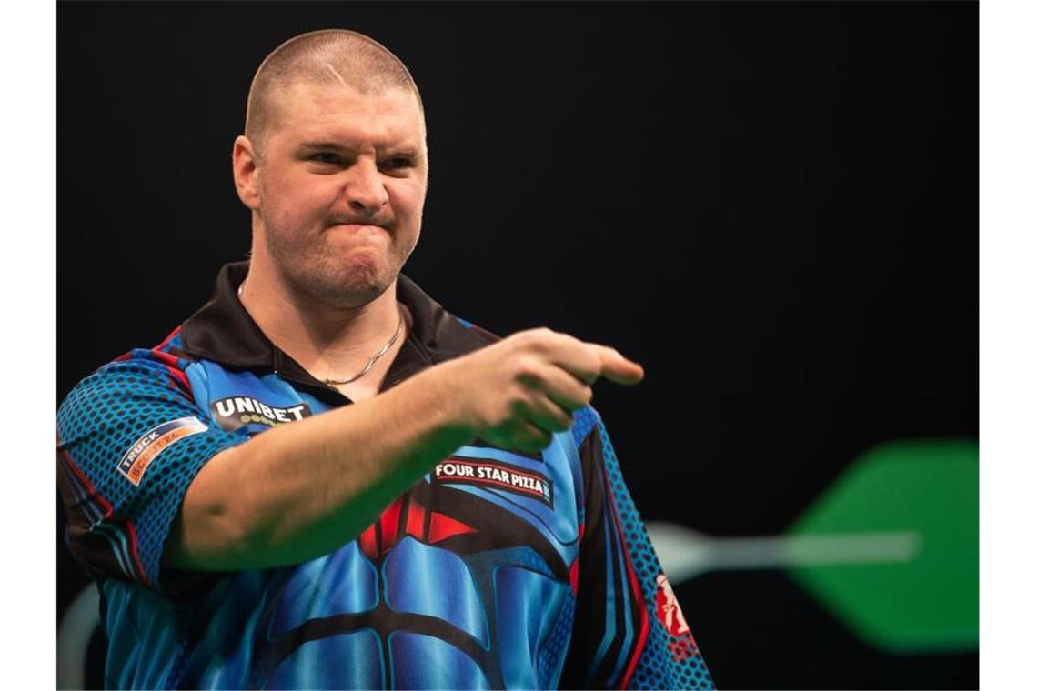 Steigt am dritten Tag bei der Darts-WM ein: Mitfavorit Daryl Gurney. Foto: Swen Pförtner/dpa