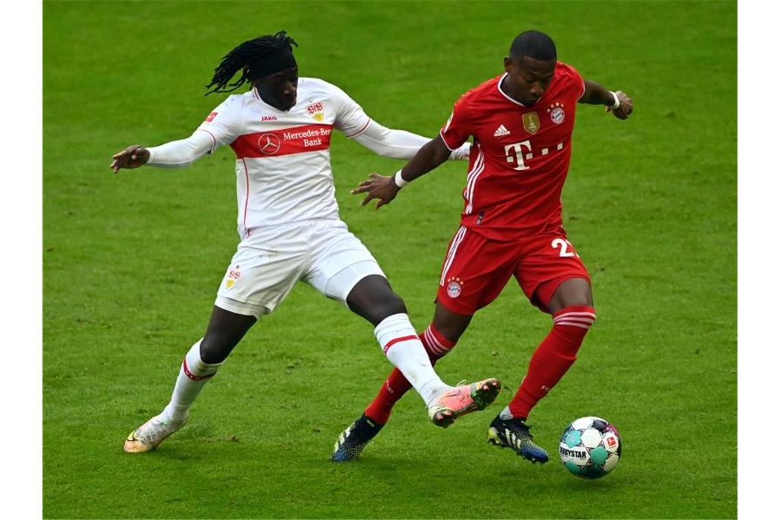 Bayern zünden in Unterzahl Offensiv-Turbo: 3:0 gegen den VfB Stuttgarts Tanguy Coulibaly und Münchens David Alaba (l-r.) in Aktion. Foto: Matthias Balk/dpa POOL/dpa