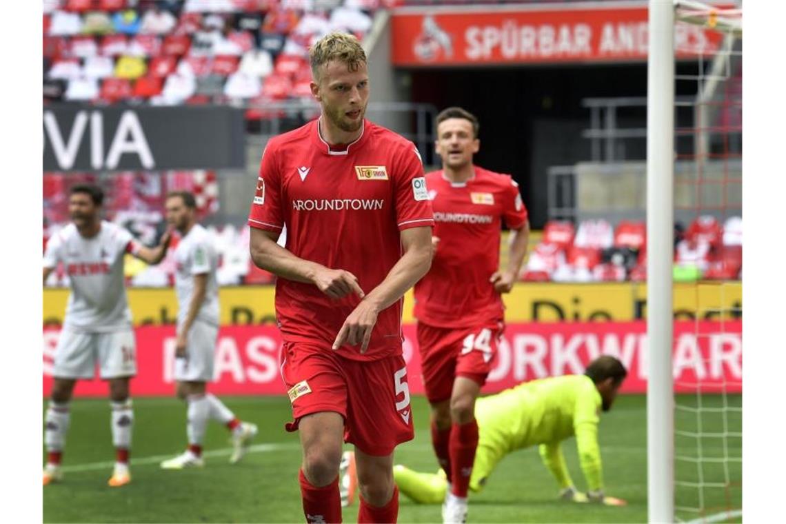 Torschütze Marvin Friedrich (vorne) feierte mit Union einen Auswärtserfolg in Köln. Foto: Martin Meissner/AP/Pool/dpa