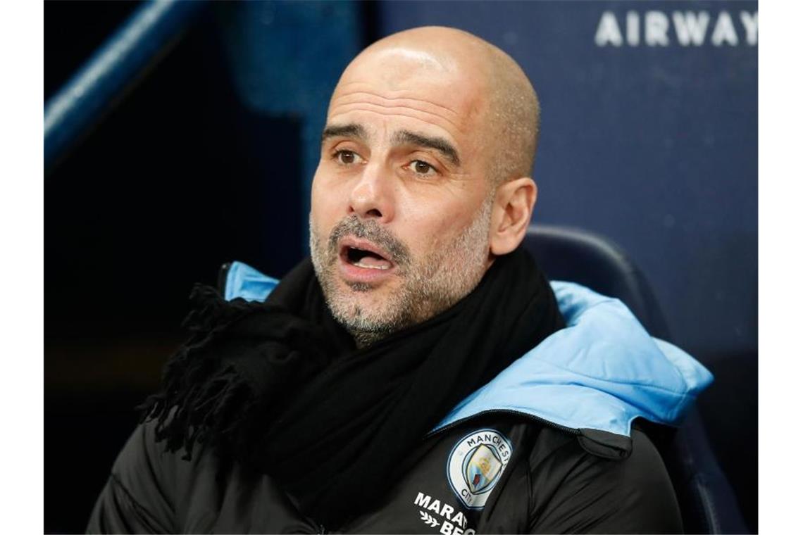 Trainer Pep Guardiola will seinen Vertrag bei Manchester City erfüllen. Foto: Martin Rickett/PA Wire/dpa