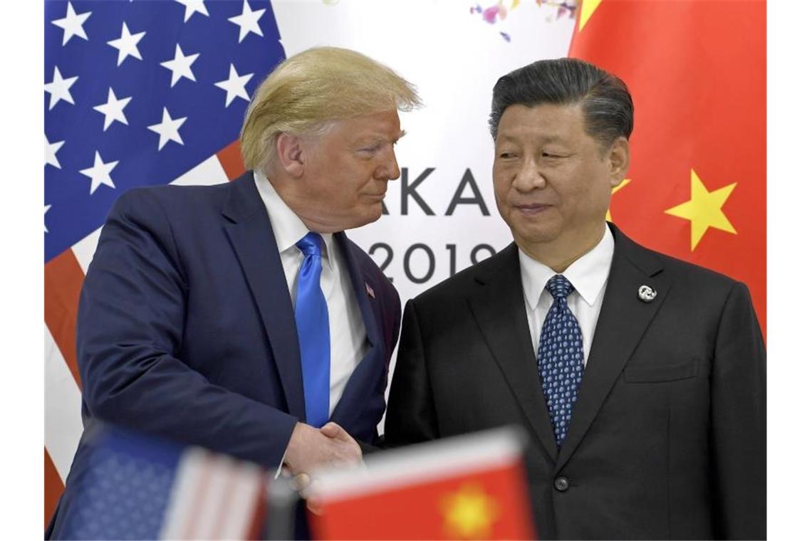 US-Präsident Donald Trump und sein chinesischer Amtskollege Xi Jinping Ende Juni bei einem Treffen in Japan. Foto: Susan Walsh/AP