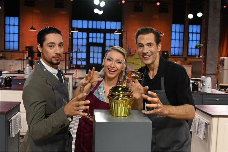 (v.l.n.r.) René Casselly, Anna-Carina Woitschack und Alexander Mazza kämpfen um den goldenen Cupcake.