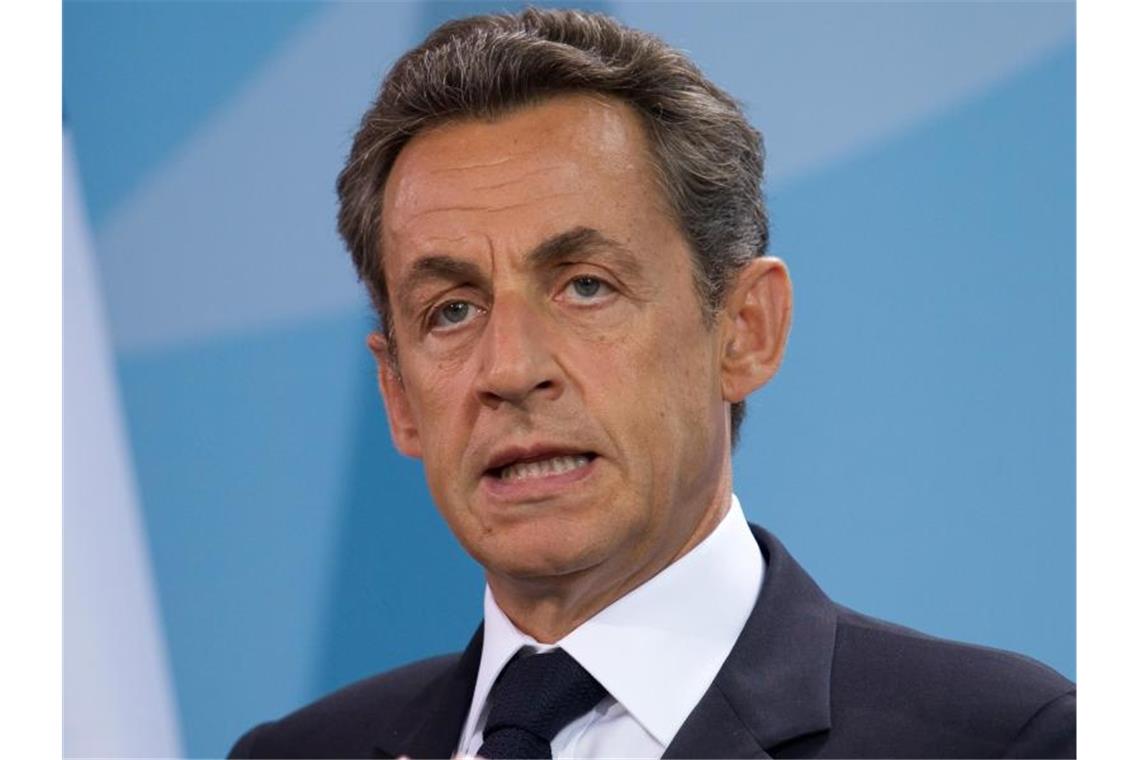 Hafturteil gegen Frankreichs Ex-Präsident Sarkozy verhängt Wegen illegaler Wahlkampffinanzierung ist Nicolas Sarkozy zu einer Haftstrafe verurteilt worde, die er als elektronisch überwachten Hausarrest mit einer Fußfessel verbüßen kann. Foto: Michael Kappeler/dpa