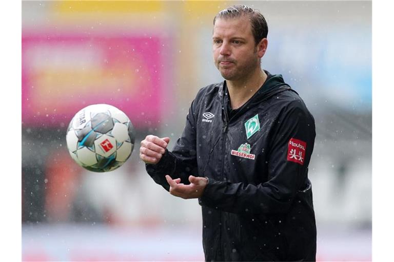 Werder-Trainer Florian Kohfeldt geht optimistisch in das Relegations-Rückspiel. Foto: Friedemann Vogel/EPA/Pool/dpa