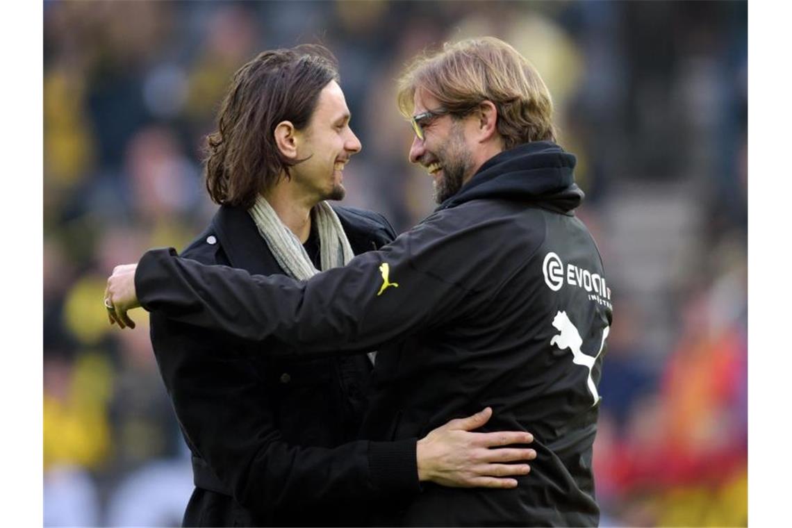 Wünscht sich, dass Jürgen Klopp (r) einmal Bundestrainer wird: Neven Subotic (l). Foto: picture alliance / dpa